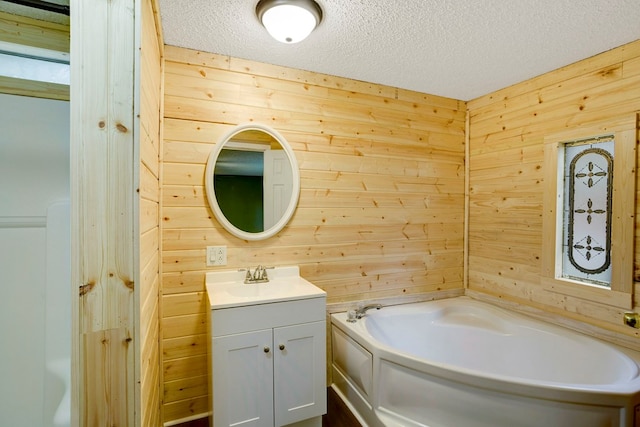 349 Kirby Ln, Murphy, NC 28906 - bathroom featuring wood walls, a bath, vanity, and a textured ceiling