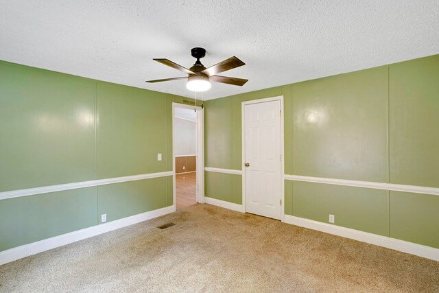 349 Kirby Ln, Murphy, NC 28906 - unfurnished room featuring visible vents, carpet floors, a textured ceiling, and ceiling fan