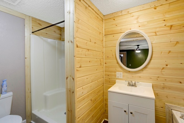 349 Kirby Ln, Murphy, NC 28906 - full bathroom with toilet, a textured ceiling, a shower stall, vanity, and wood walls