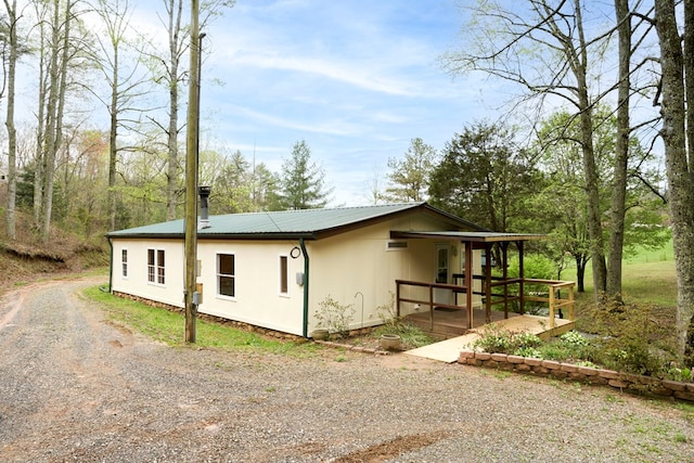 349 Kirby Ln, Murphy, NC 28906 - view of side of home featuring metal roof and dirt driveway