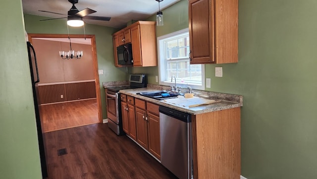 349 Kirby Ln, Murphy, NC 28906 - kitchen featuring dark wood-style floors, a ceiling fan, decorative light fixtures, appliances with stainless steel finishes, and a sink