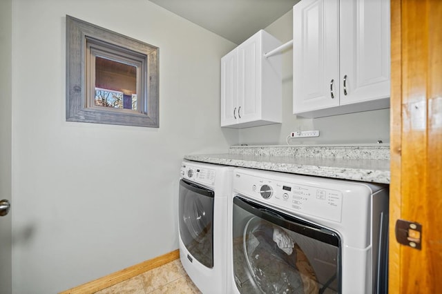 washroom featuring separate washer and dryer, cabinets, and light tile patterned flooring