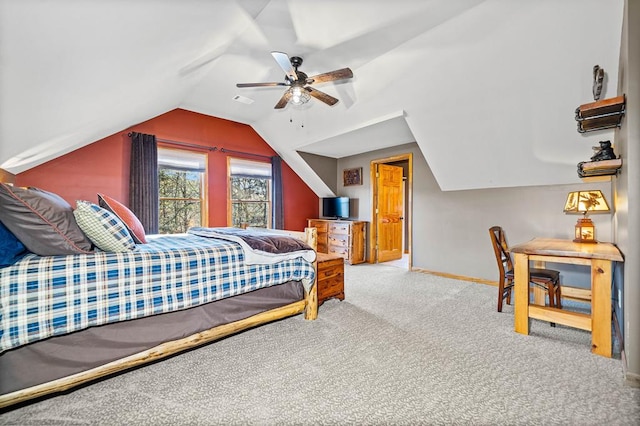 carpeted bedroom featuring lofted ceiling and ceiling fan