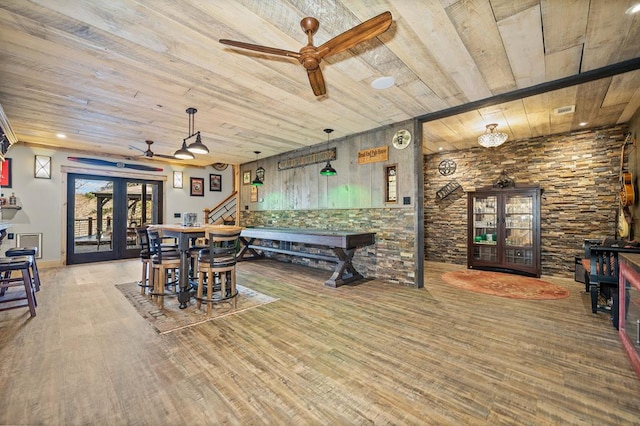 dining area with ceiling fan, wood ceiling, french doors, and hardwood / wood-style flooring