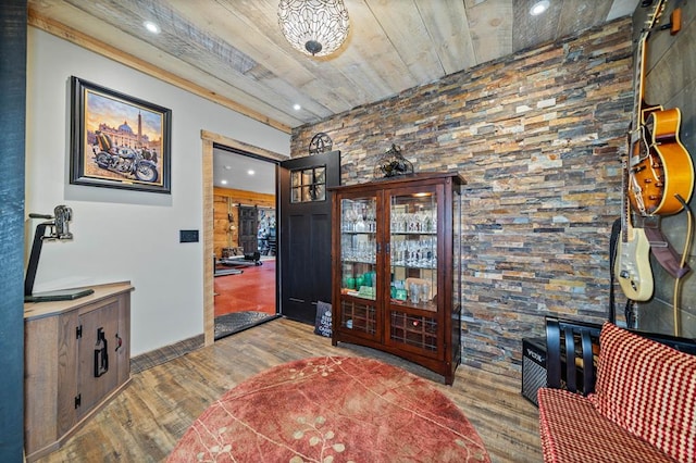 living area with wood ceiling and hardwood / wood-style floors