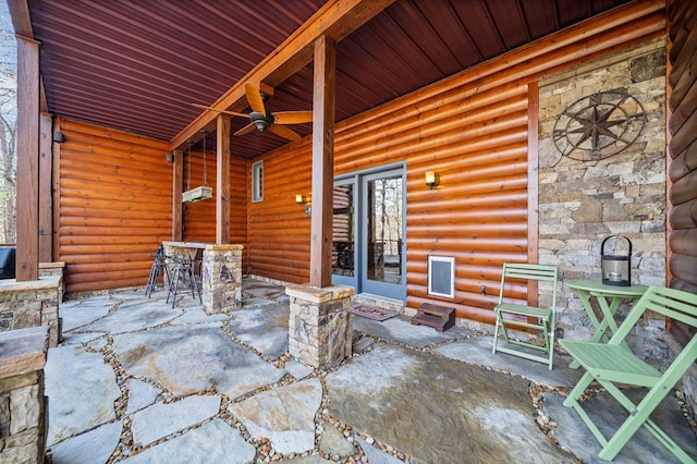 view of patio featuring ceiling fan