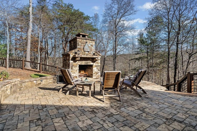 view of patio / terrace with an outdoor stone fireplace