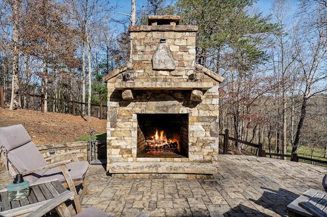 view of patio with an outdoor stone fireplace