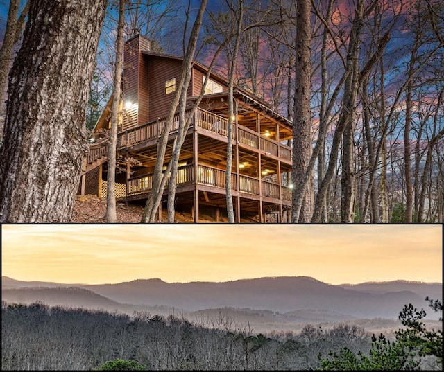 back house at dusk featuring a balcony and a deck with mountain view