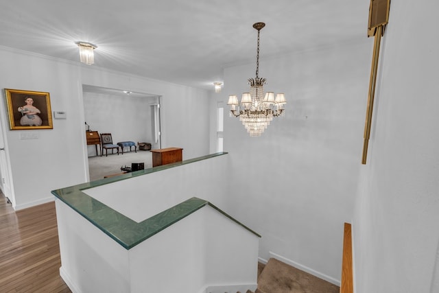 498 Old Dyer Rd, Hayesville, NC 28904 - stairs with wood finished floors, ornamental molding, a chandelier, and baseboards