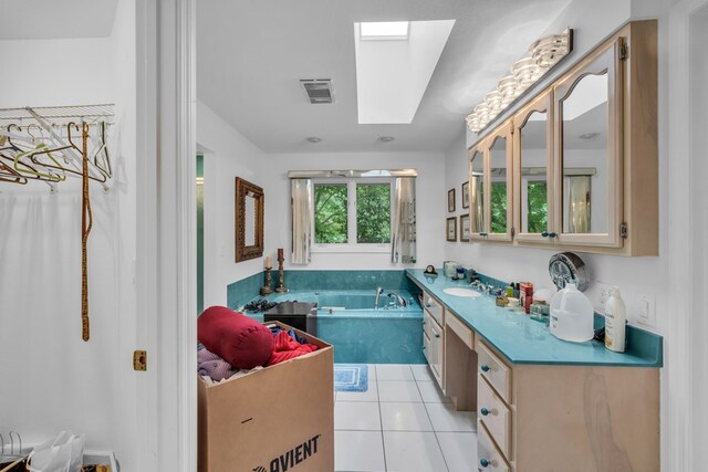 498 Old Dyer Rd, Hayesville, NC 28904 - kitchen with a skylight, a sink, glass insert cabinets, and light tile patterned floors