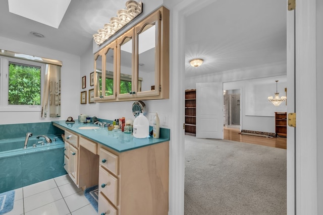 498 Old Dyer Rd, Hayesville, NC 28904 - bathroom with a skylight, a chandelier, vanity, and a garden tub