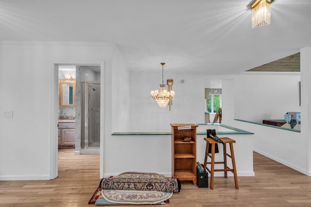 498 Old Dyer Rd, Hayesville, NC 28904 - kitchen with wood finished floors, baseboards, a chandelier, and ornamental molding