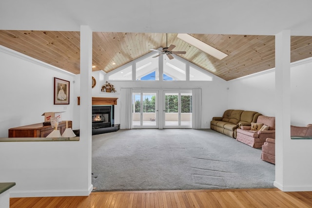 498 Old Dyer Rd, Hayesville, NC 28904 - living room with a glass covered fireplace, wooden ceiling, a ceiling fan, a skylight, and baseboards