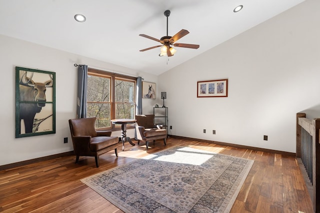 sitting room with baseboards, a ceiling fan, wood finished floors, recessed lighting, and high vaulted ceiling