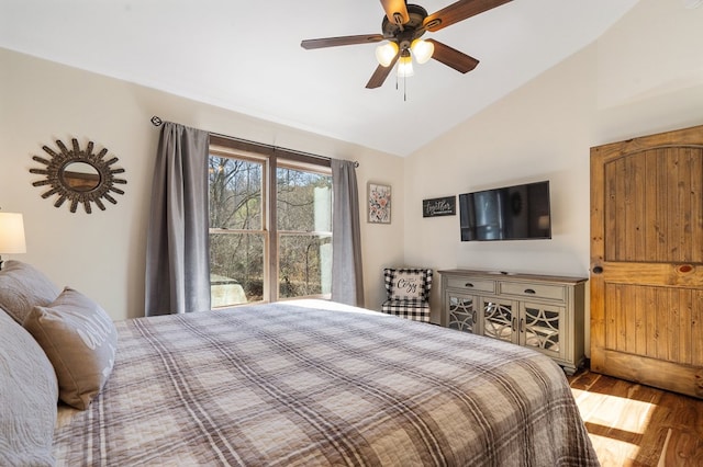 bedroom featuring wood finished floors, a ceiling fan, and high vaulted ceiling