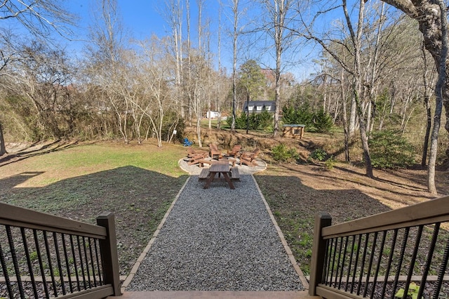view of yard with an outdoor fire pit