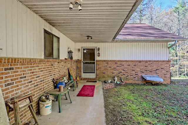 entrance to property featuring a patio