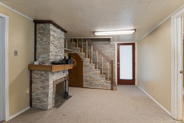 unfurnished living room with carpet floors and crown molding