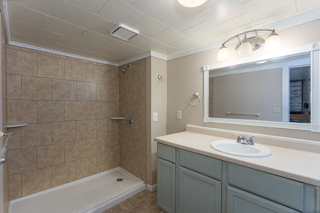 bathroom featuring vanity and a tile shower