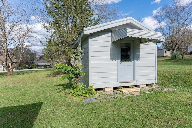 view of outdoor structure with a yard