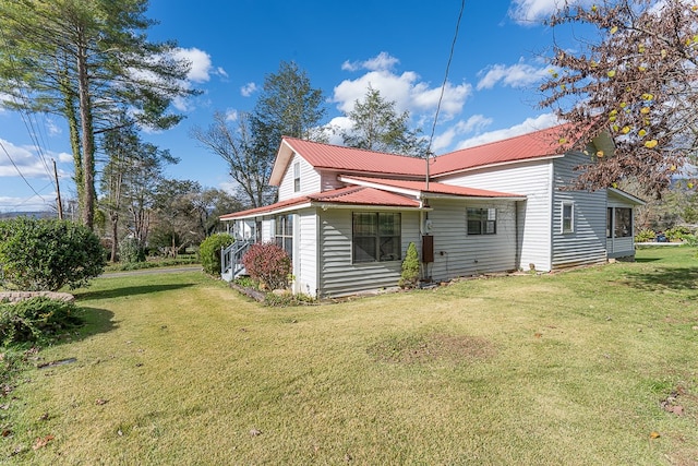 back of house featuring a yard