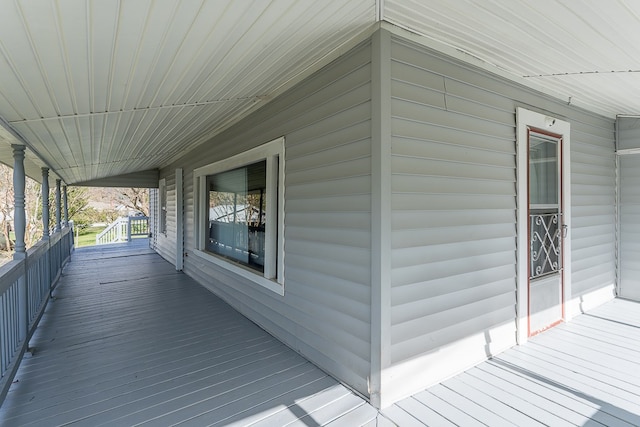 wooden terrace featuring a porch