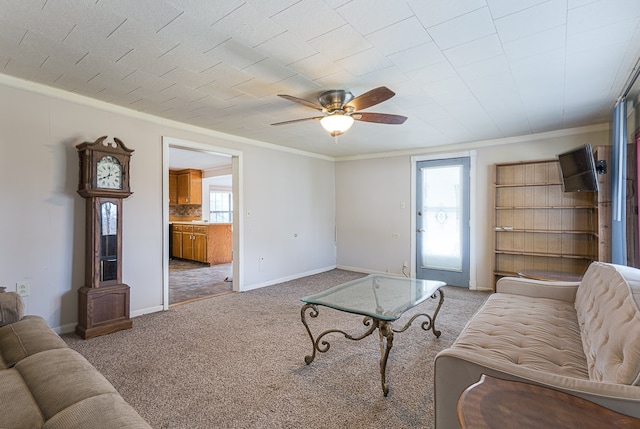 living room featuring carpet flooring, a wealth of natural light, and ceiling fan