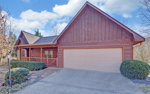 view of front of property with a garage and covered porch