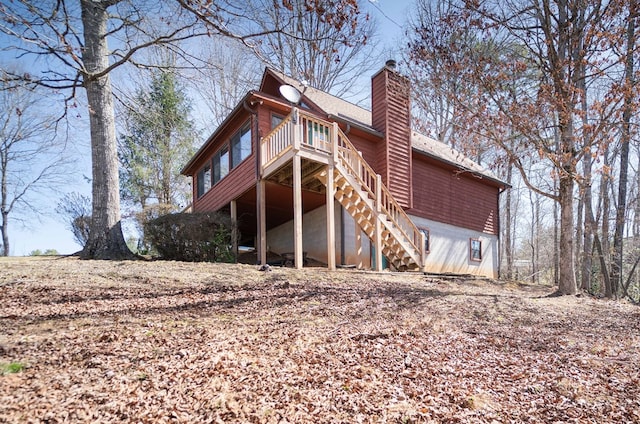 1544 Country Walk, Murphy, NC 28906 - rear view of house with stairway, a deck, and a chimney