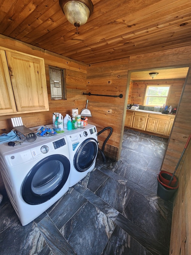 27 Russell Farm Rd, Andrews, NC 28901 - laundry area with cabinet space, washer and clothes dryer, wood ceiling, wooden walls, and dark stone finish flooring