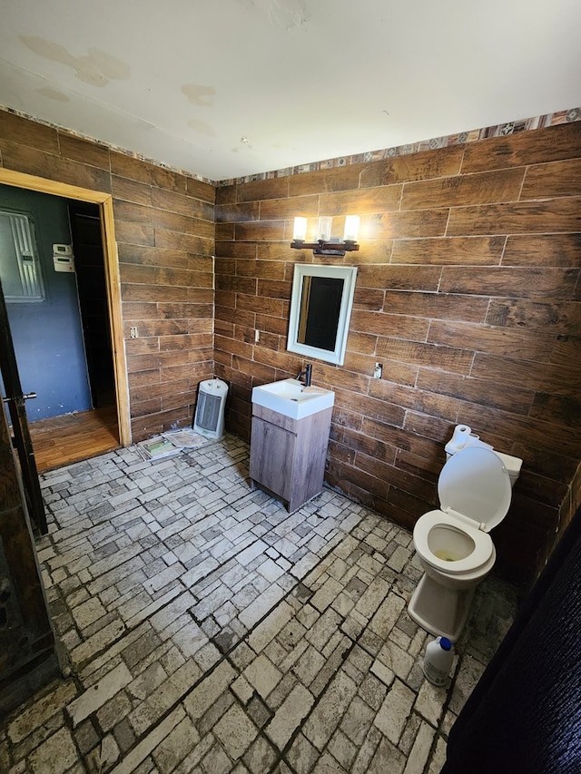 27 Russell Farm Rd, Andrews, NC 28901 - bathroom with wood walls, vanity, and toilet