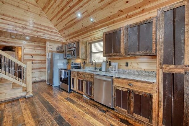 kitchen with wood ceiling, lofted ceiling, appliances with stainless steel finishes, dark wood-style floors, and a sink