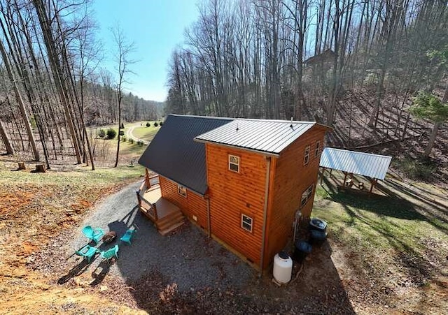 view of property exterior featuring metal roof