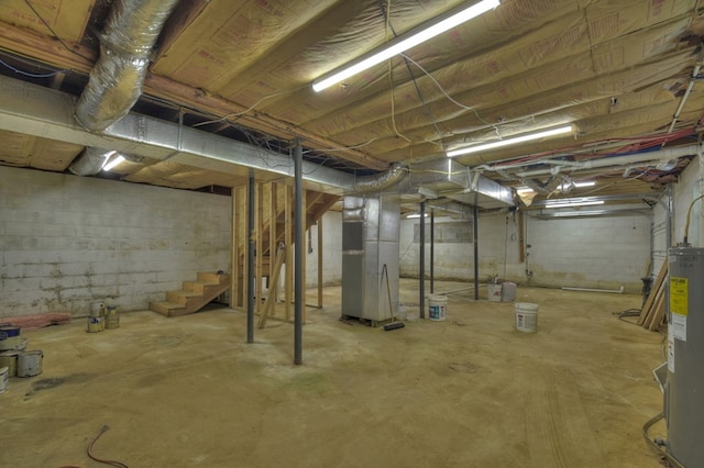 975 Goss Rd, Epworth, GA 30541 - unfinished below grade area featuring stairs, heating unit, and electric water heater