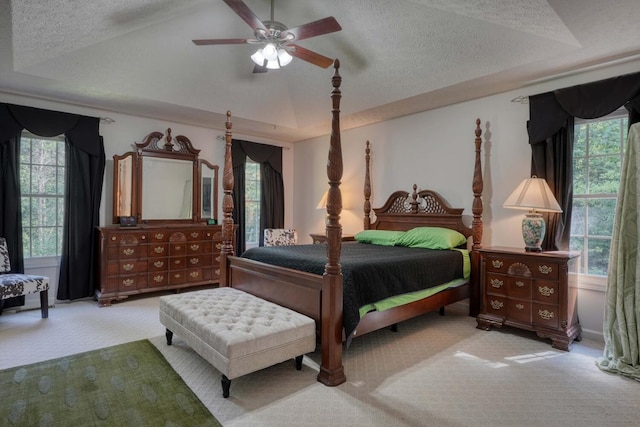 bedroom with carpet floors, multiple windows, and ceiling fan