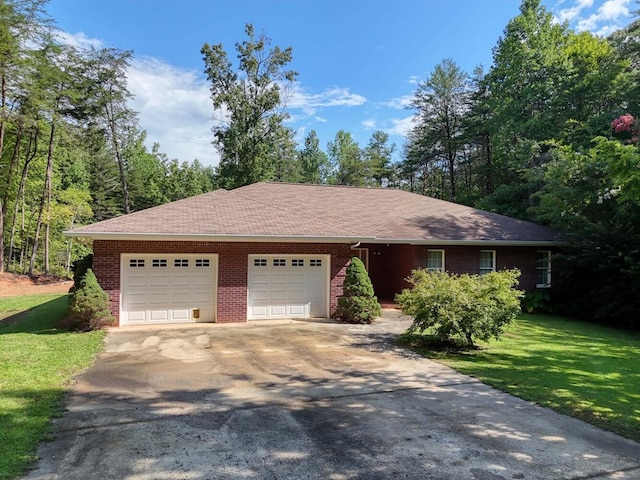 single story home with a garage and a front lawn