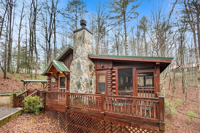 back of property featuring a sunroom