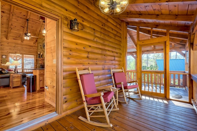 interior space with ceiling fan