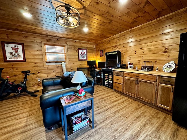 living room featuring light wood-type flooring and wood ceiling