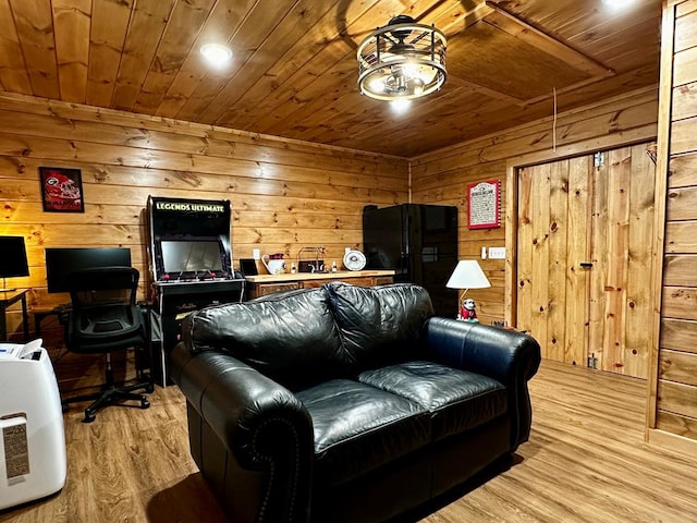 living room featuring wooden ceiling, attic access, light wood-style flooring, and wood walls