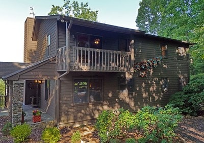 rear view of house featuring a balcony