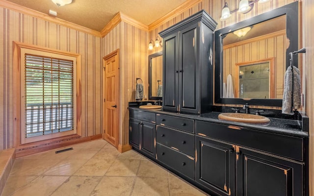 bathroom with tile floors, wooden walls, dual bowl vanity, and ornamental molding