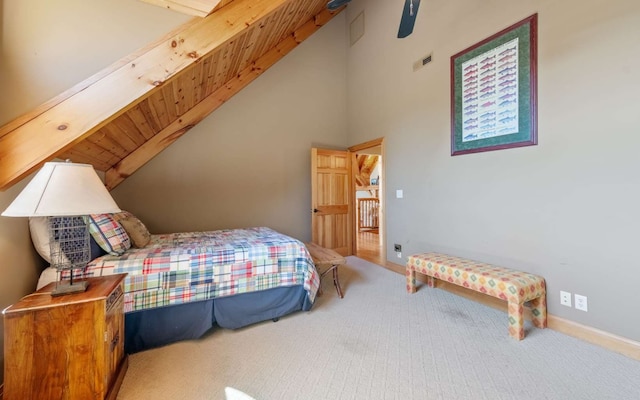 carpeted bedroom featuring ceiling fan and lofted ceiling