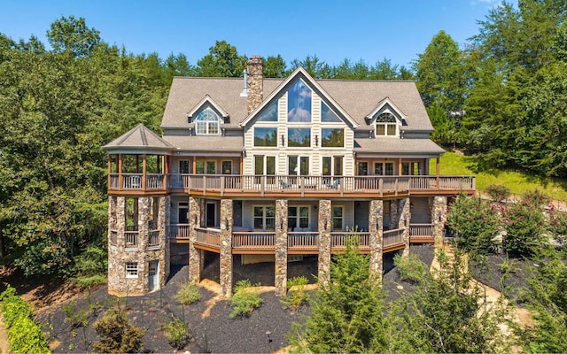 rear view of property featuring a deck