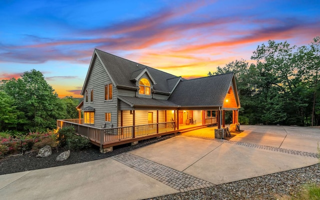 view of back house at dusk