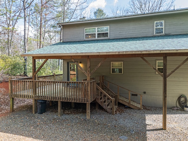 back of house featuring a deck