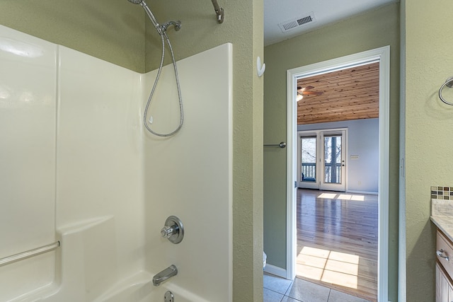 bathroom with vanity, tile patterned floors,  shower combination, and wooden ceiling