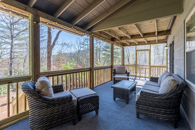 sunroom / solarium with wood ceiling and beam ceiling