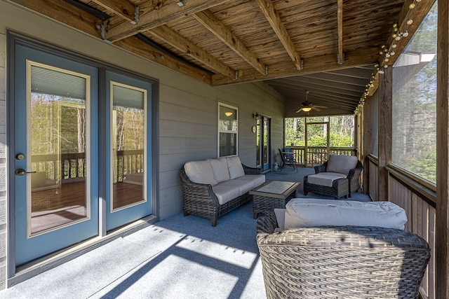 sunroom with lofted ceiling with beams and wooden ceiling